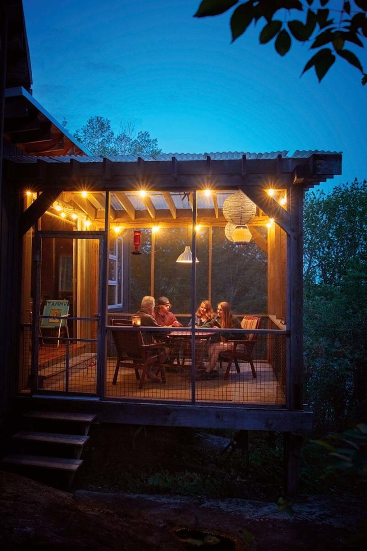 The Macklin's gather in their screened porch for board games.