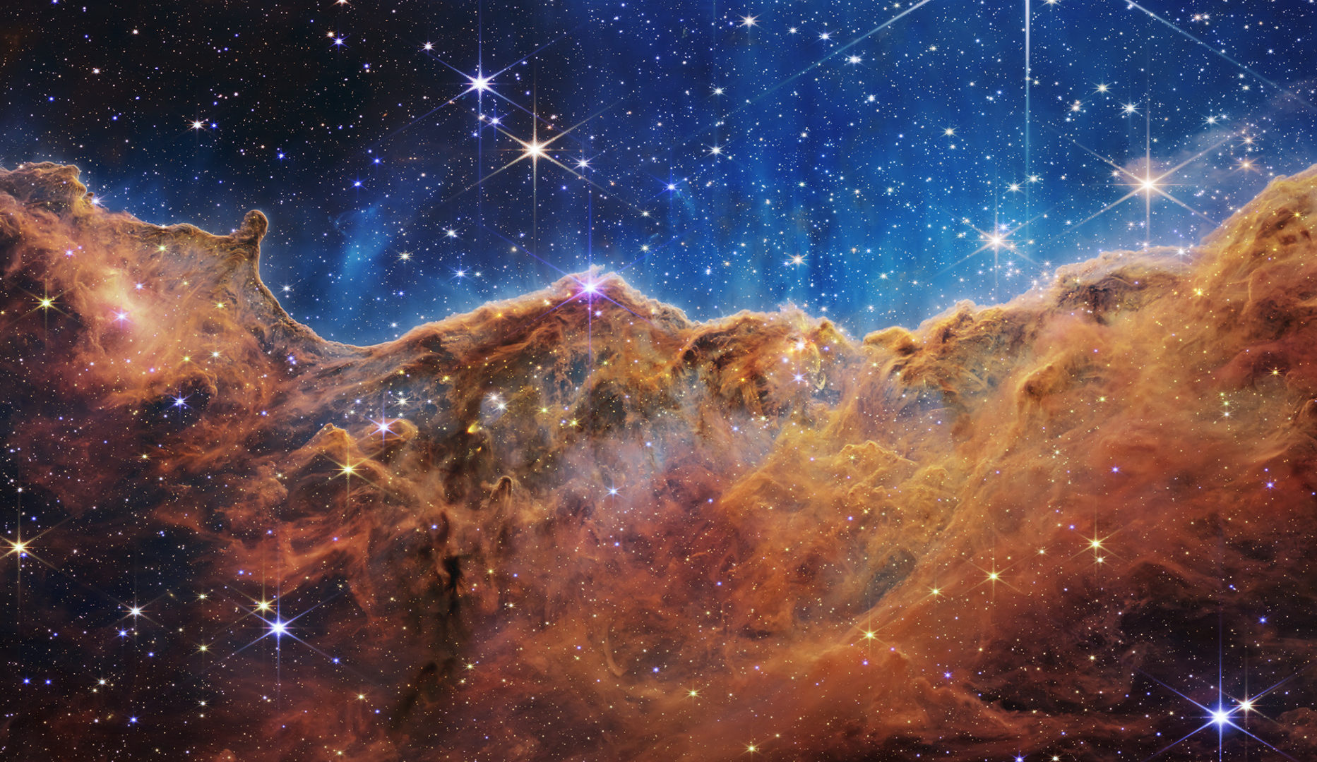 A photo of cosmic cliffs in the Carina Nebula by the James Webb Space Telescope