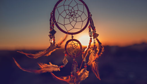 A dream catcher against the sunset