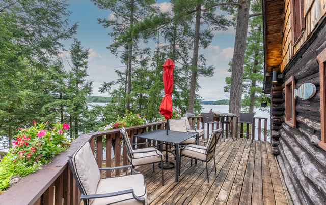 a look at the exterior deck with the lake in the distance