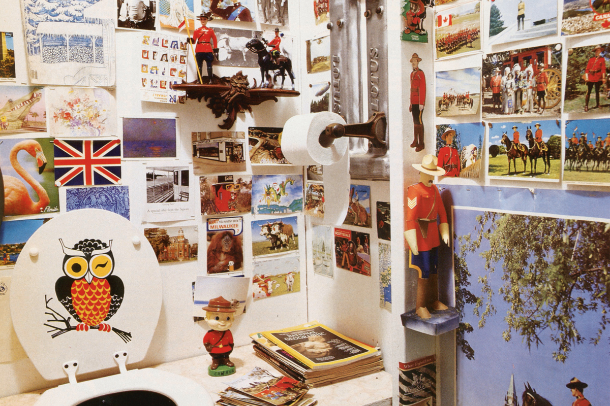 an outhouse covered in Royal Canadian Mountie memorabilia
