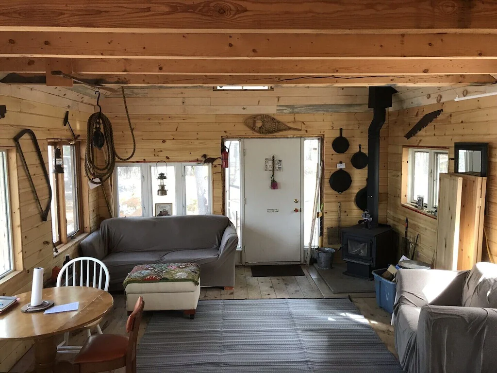 couch and table and chairs inside cabin