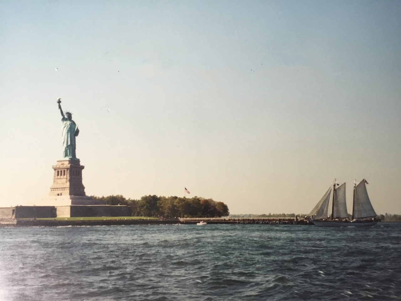 The statue of liberty as seen from the water