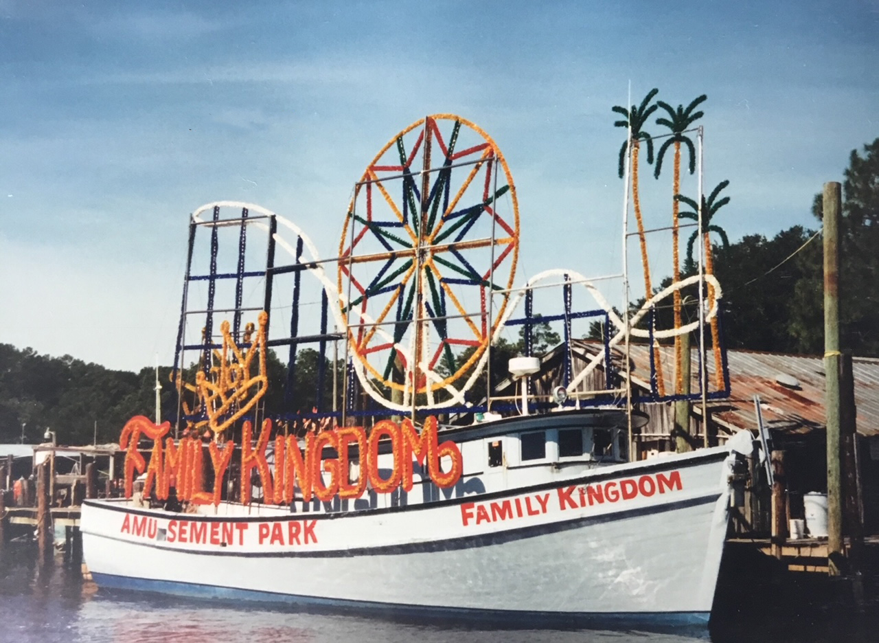 a boat docked outside an amusement park