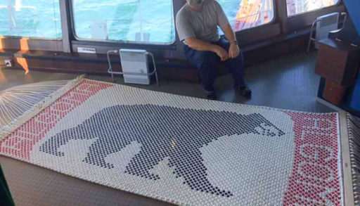 Mark Hurst poses with a hammock he made of the Algoma bear