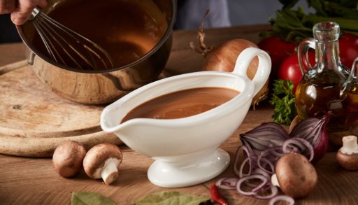 gravy boat being poured
