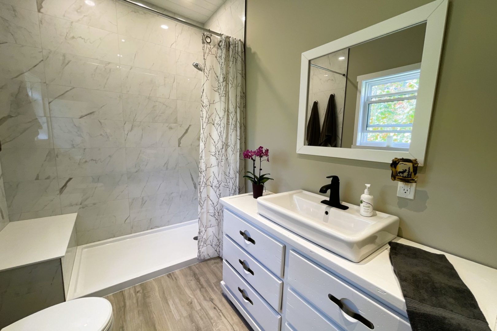 inside of bathroom 1 with a shower stall