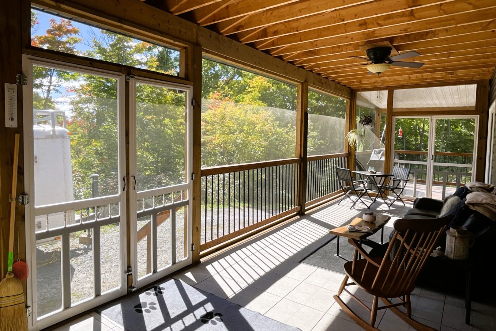 screened-in porch with lounge chairs