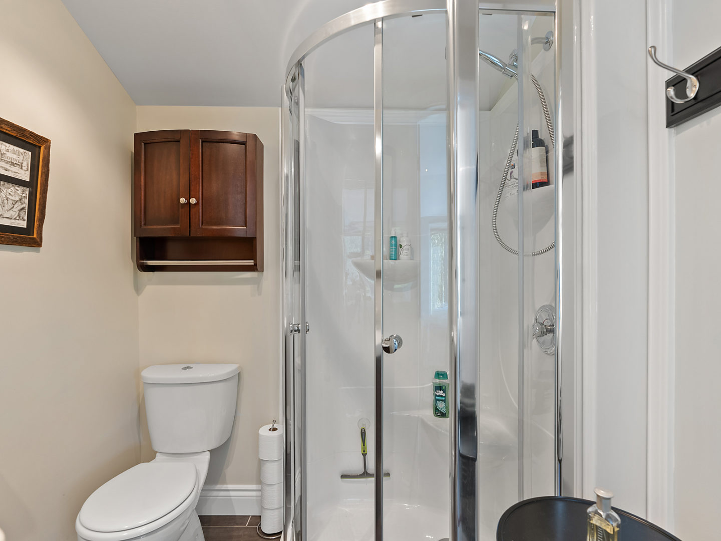 Standup shower and toilet in bathroom