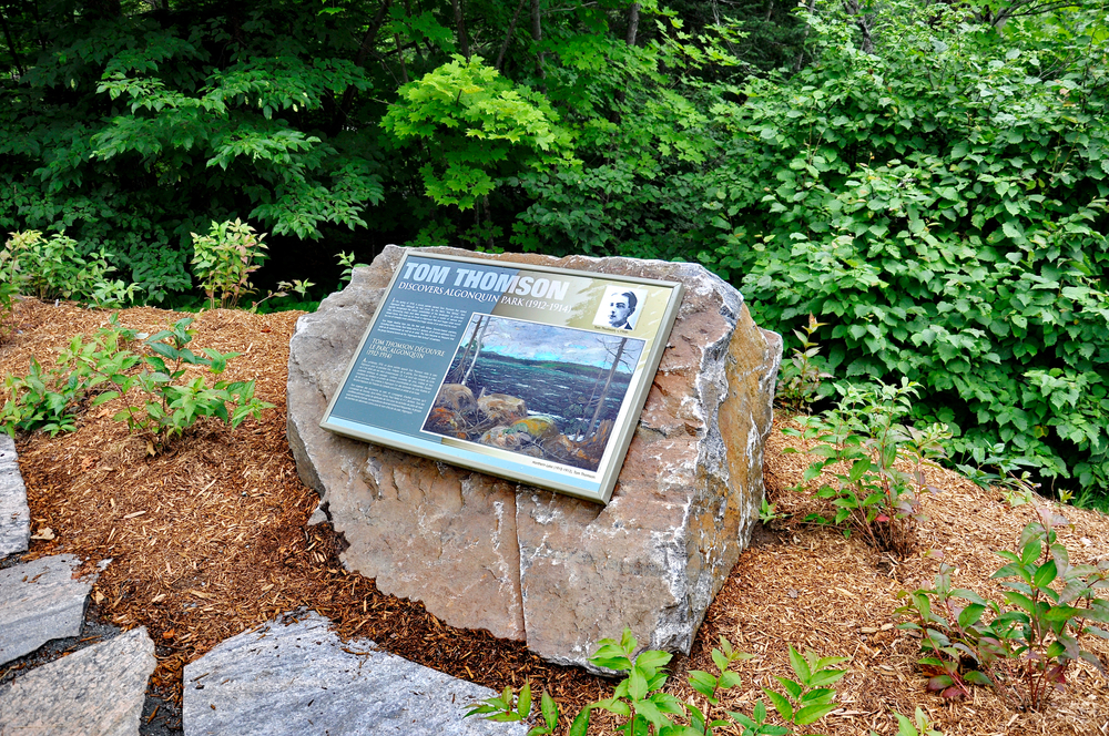 A commemorative plaque in honour of Tom Thomson, mounted to a rock