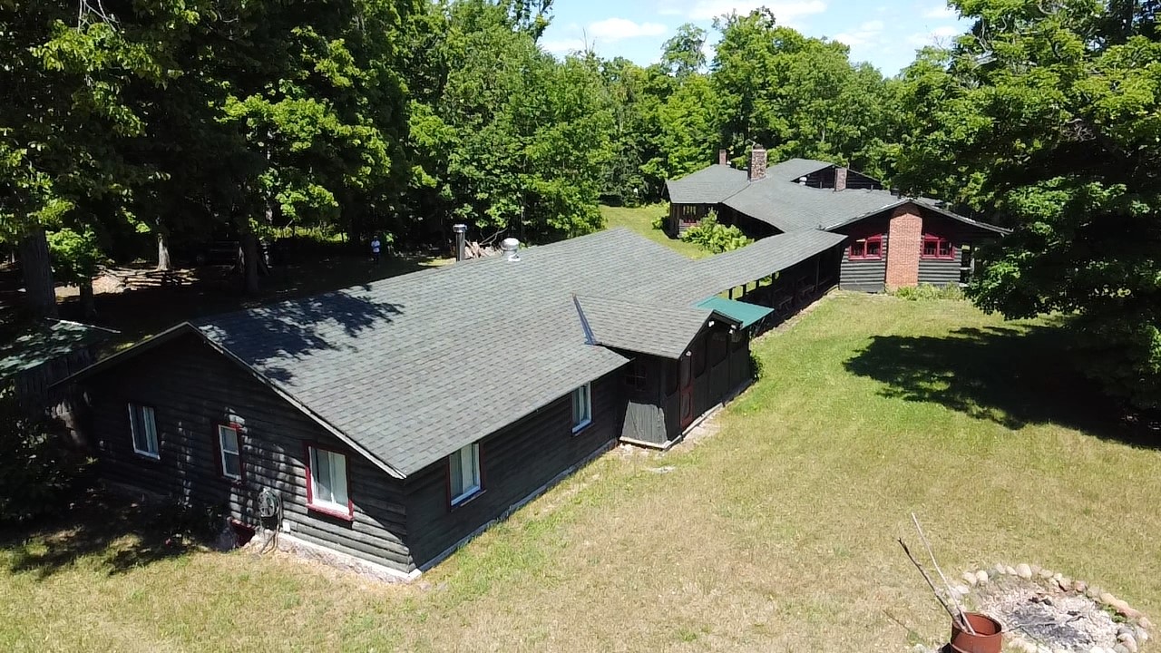 Overhead shot of a long one-story cottage.