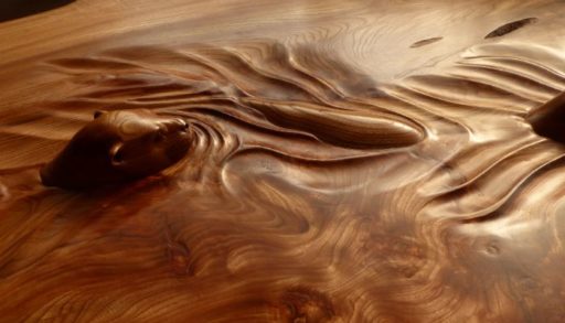 A wood carving of otters