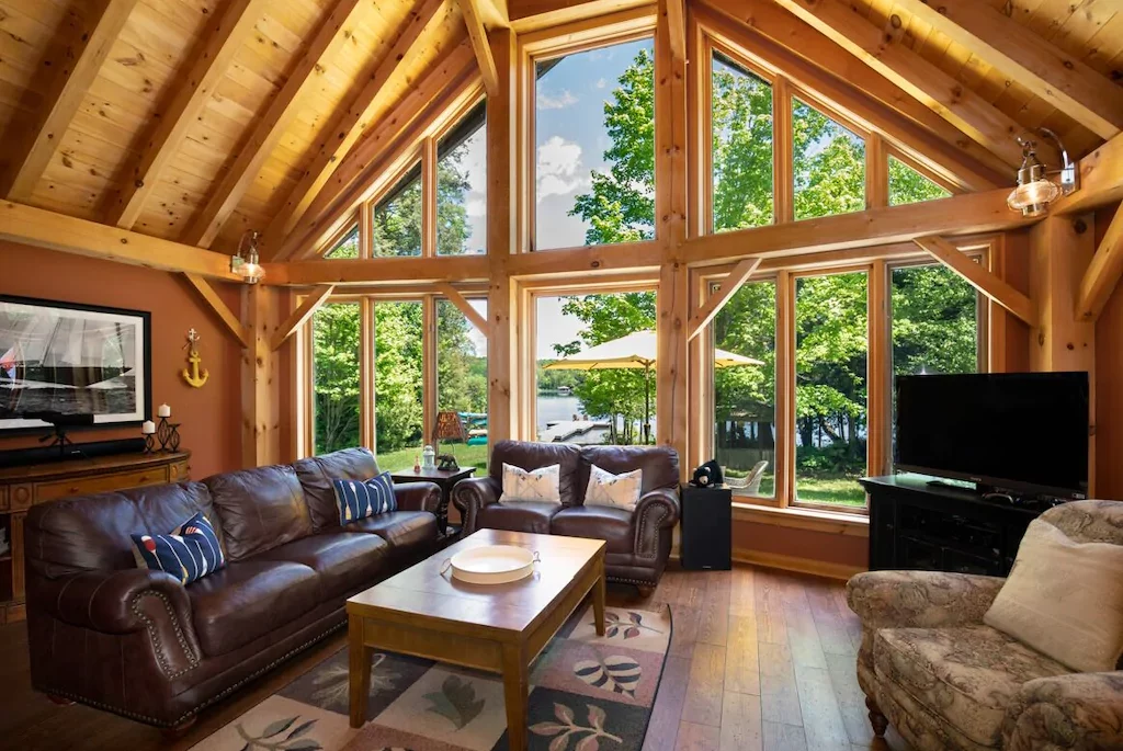 large post and beam construction with floor-to-ceiling windows