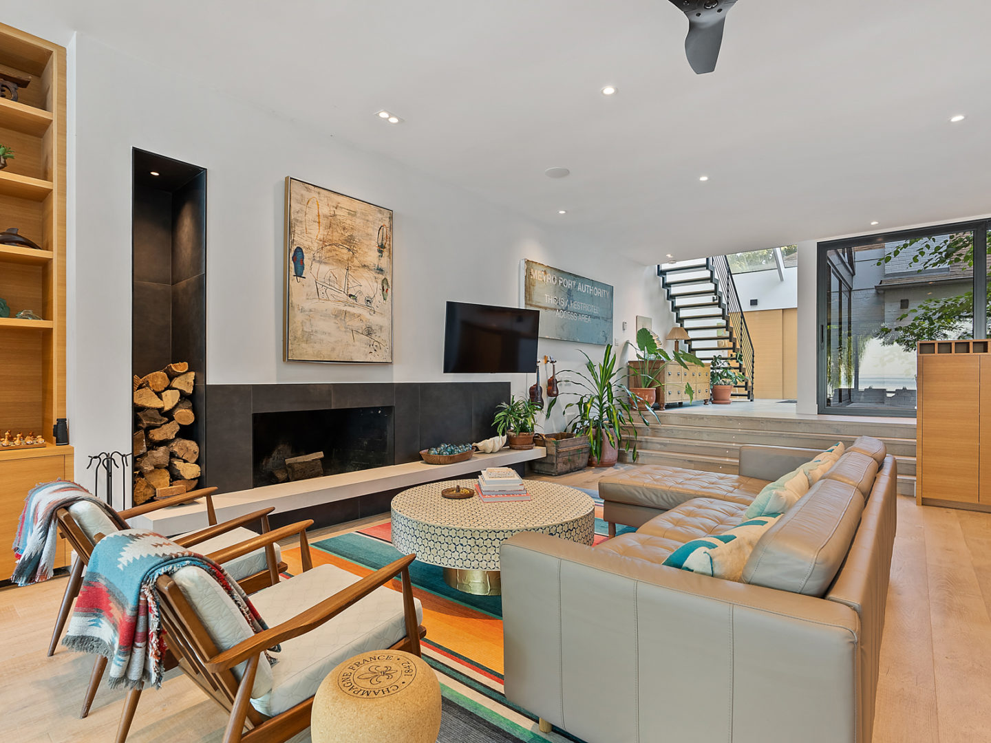 A bright living space with large couches around a small coffee table.