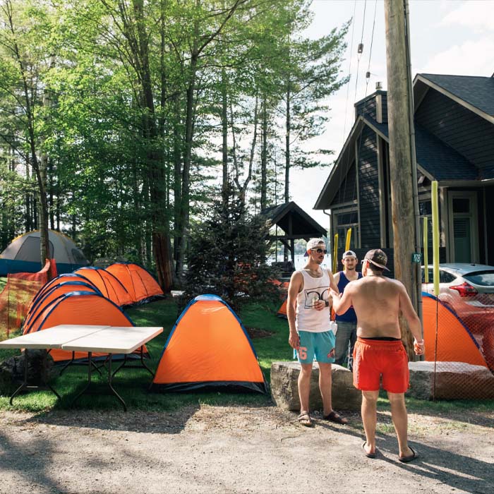 A collection of tents beside the cottage