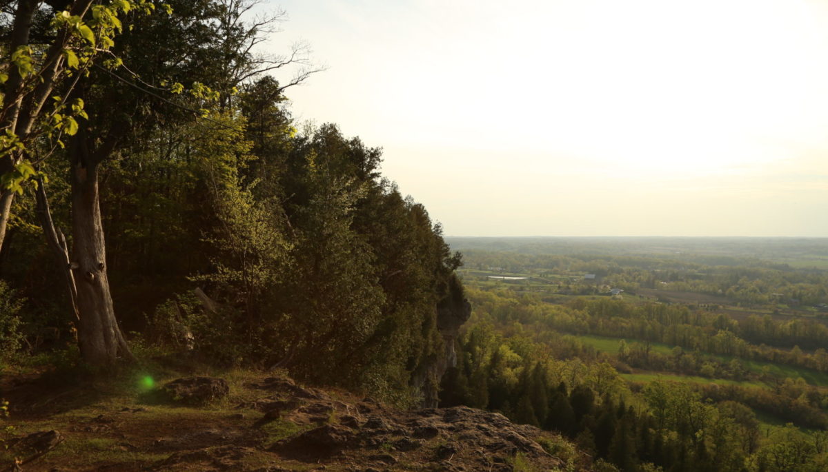 Sunset from the background of the top of a cliff. Mount Nemo Conservation Area in Ontario Canada, a hotspot for outdoor climbing and hiking. Bill 23