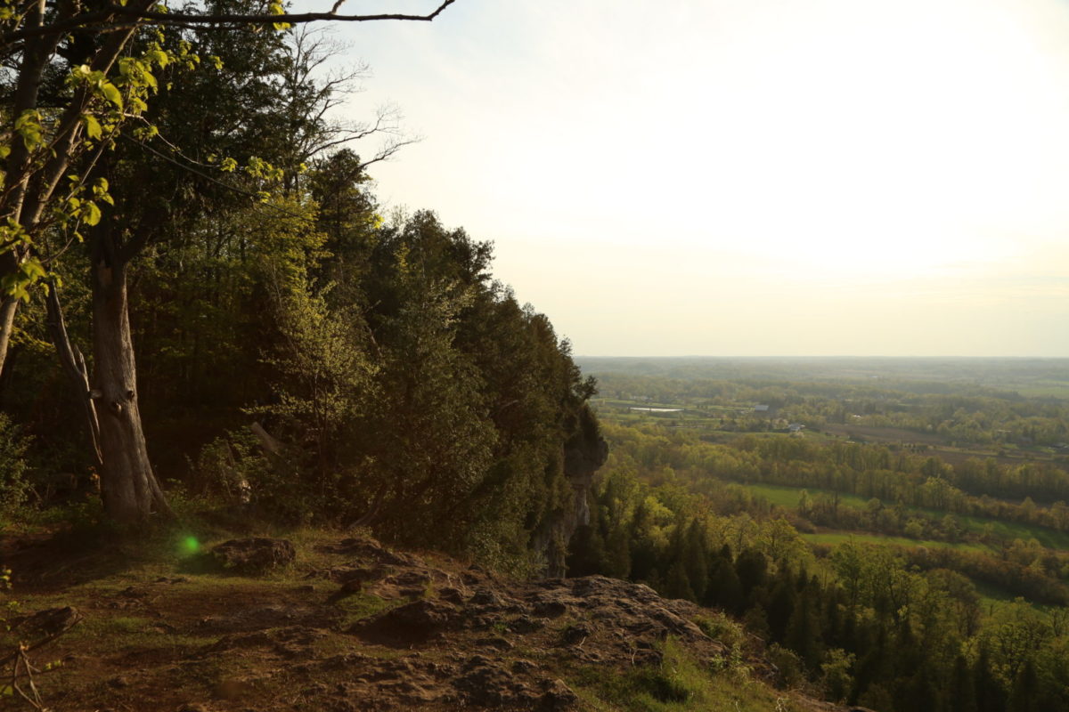 Sunset from the background of the top of a cliff. Mount Nemo Conservation Area in Ontario Canada, a hotspot for outdoor climbing and hiking. Bill 23