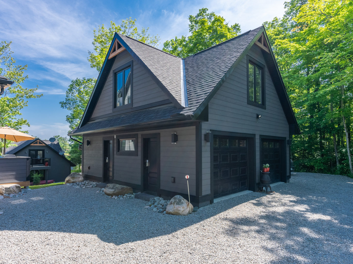 Exterior of a large, detached two-story garage.
