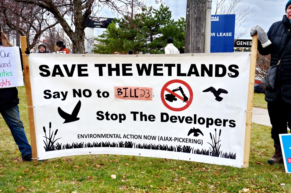 save the wetlands sign at protest in Pickering