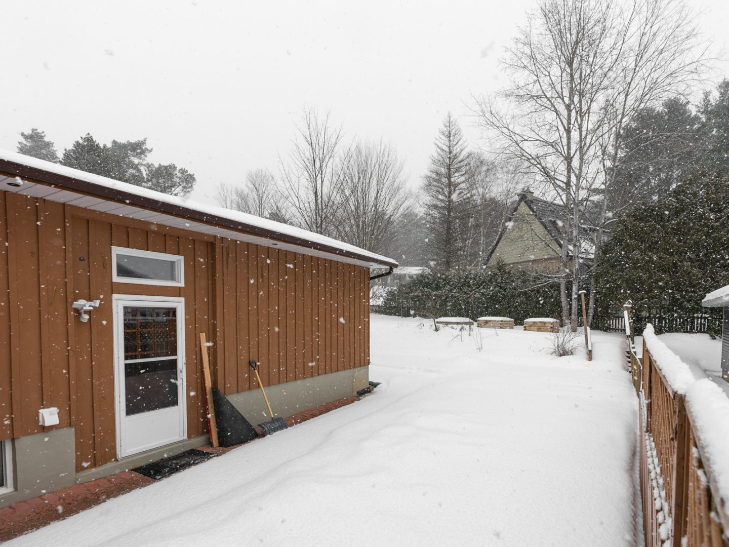 The side of a house with an entrance door.