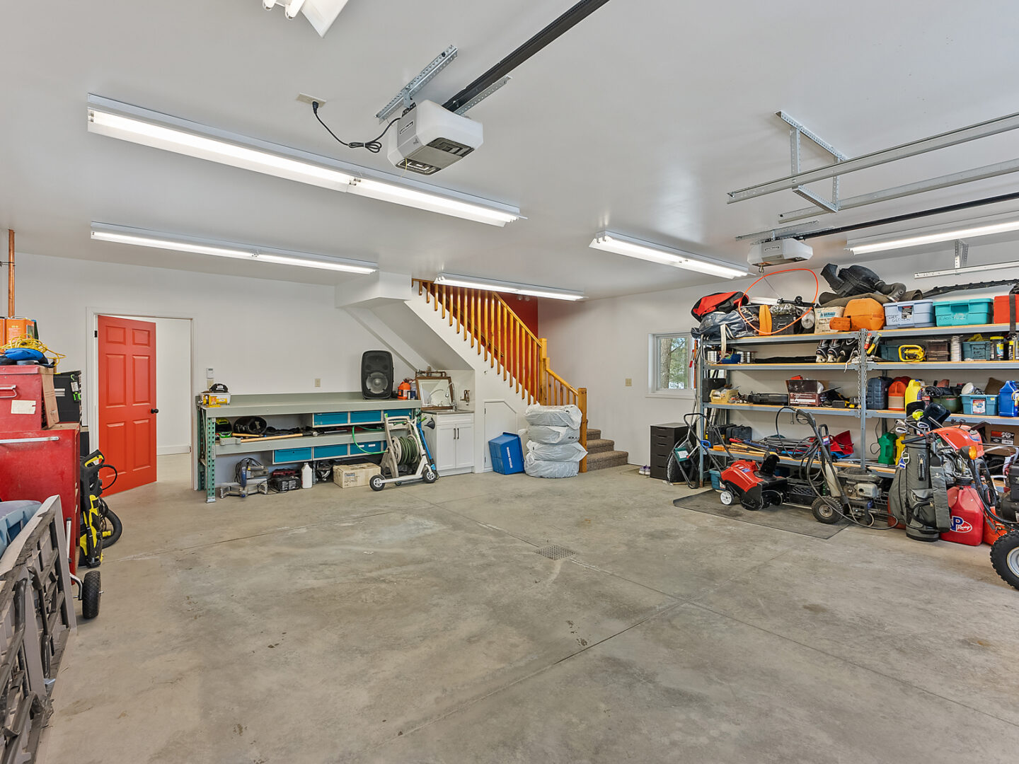 Inside a big two-car garage with lots of free space.