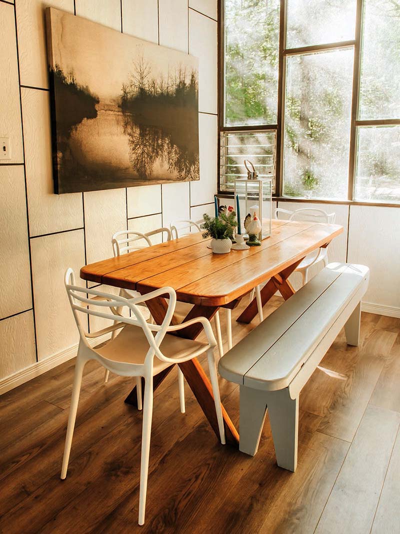 Masters chairs around a sunny kitchen table at the cottage