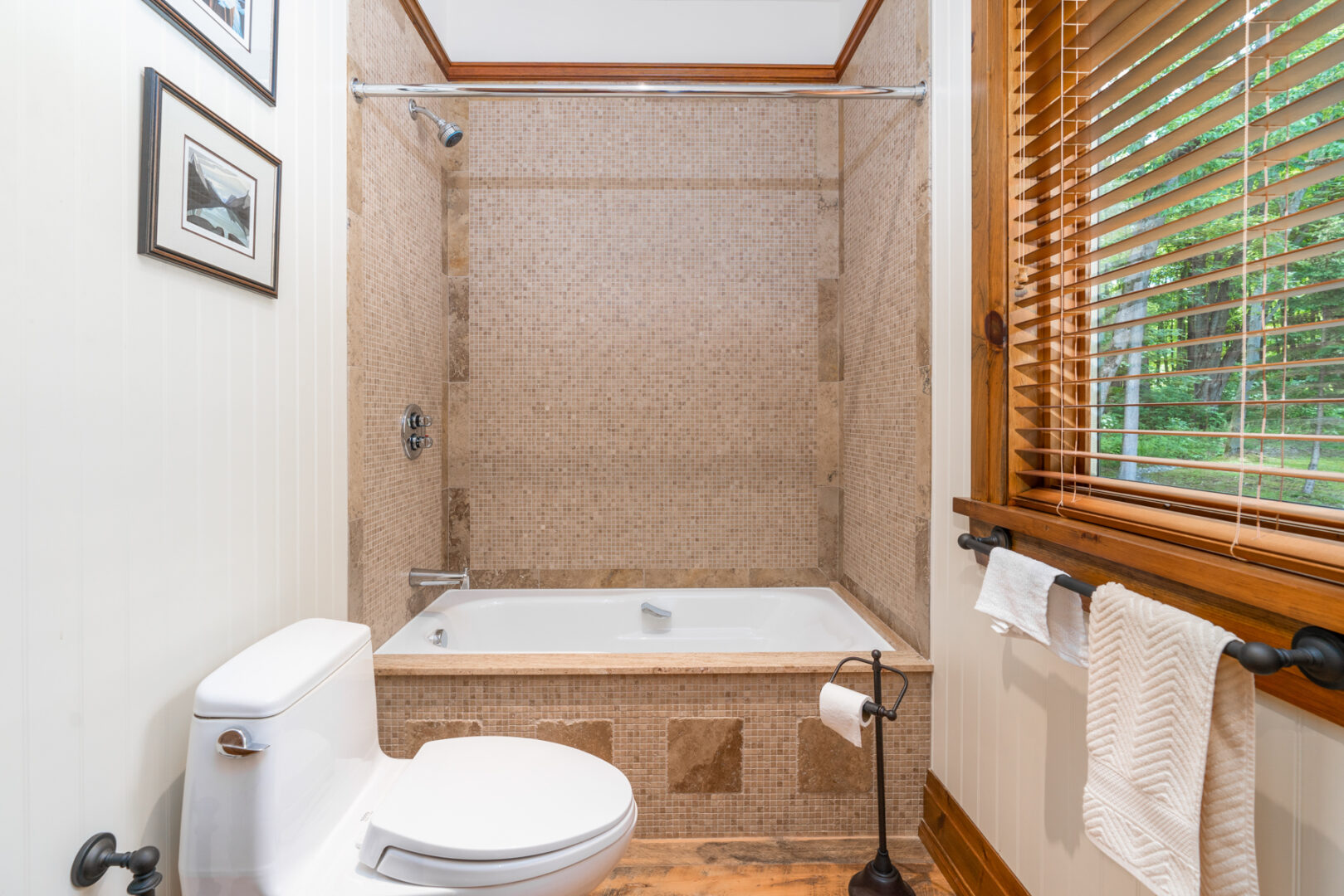 A small bathroom with a toilet and a shower.