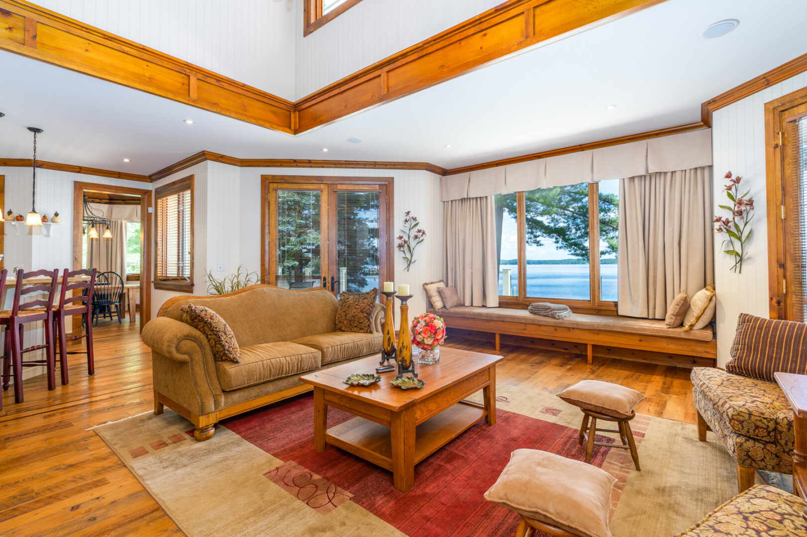 A bright, open-concept living area with couches and large windows.