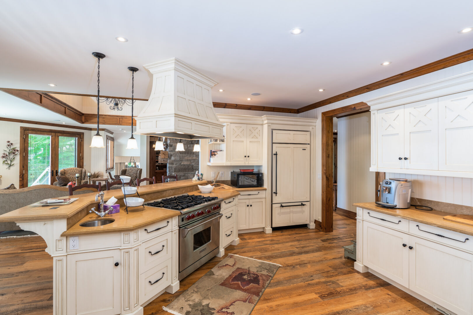 A bright kitchen space with white cabinets and modern appliances.