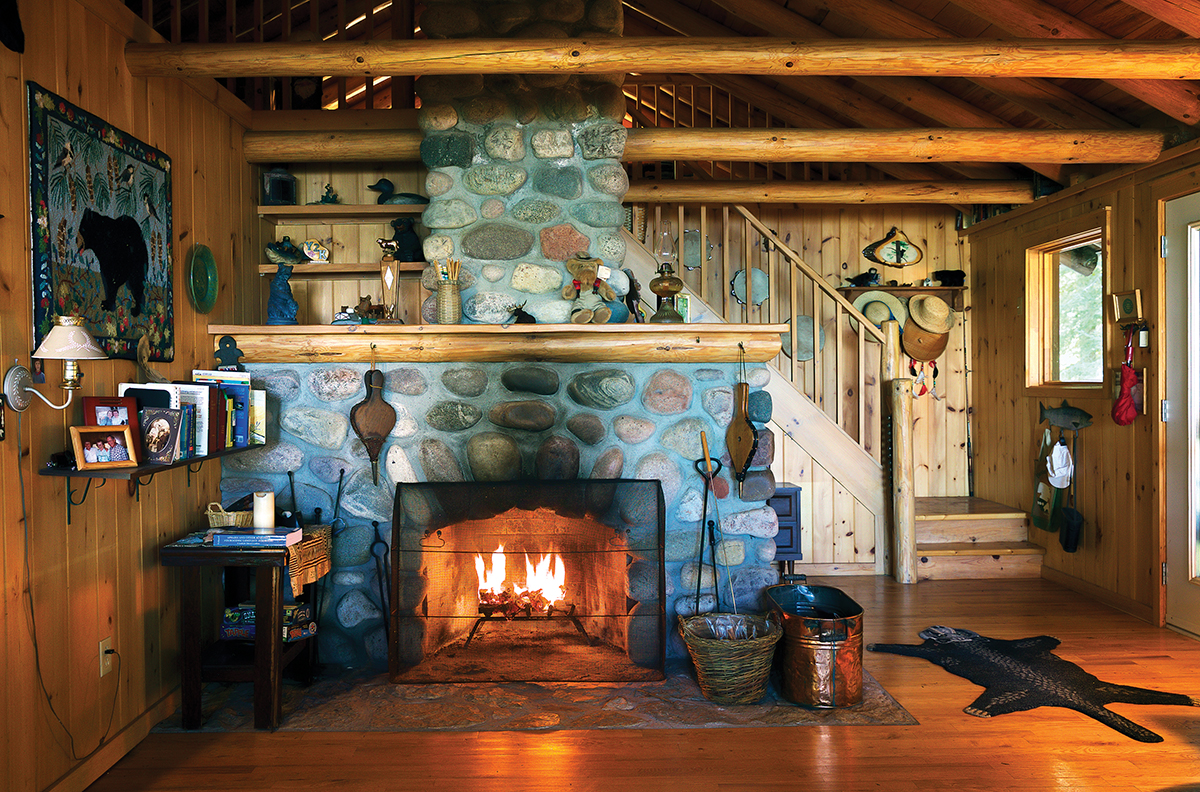 Stone fireplace and mantle in the Crodwer's living room