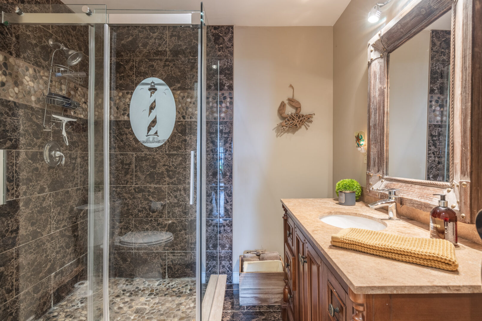 A big, updated bathroom with a walk-in shower, a toilet, and a sink.