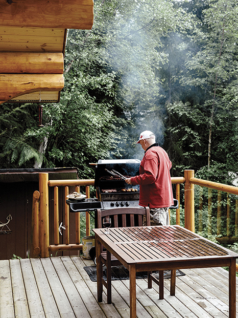 Mark Adam grills on the deck