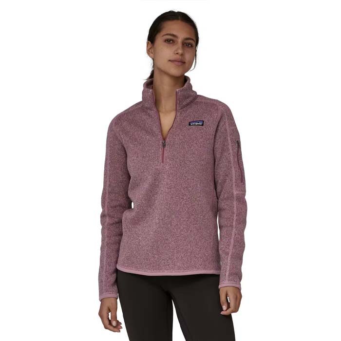 woman modelling a pink Patagonia quarter zip sweater