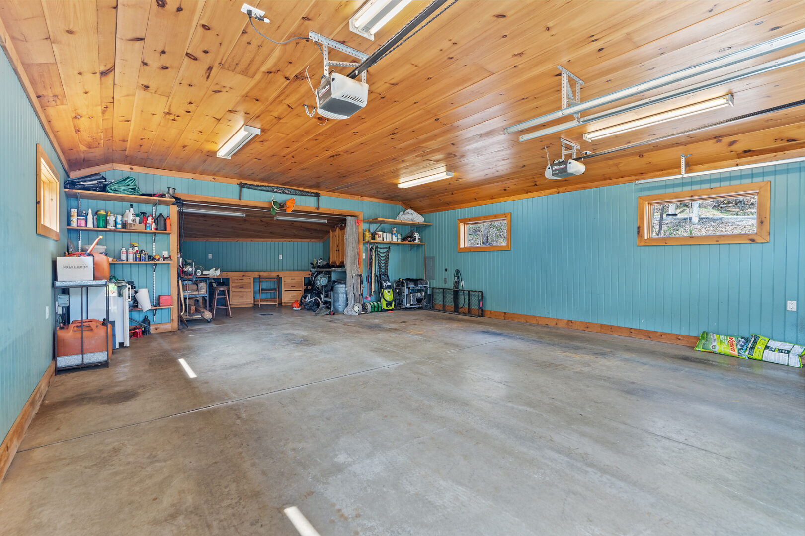 Interior of a large two-car garage with lots of storage space.