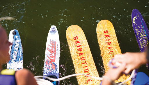 two pairs of waterskis hanging over the water