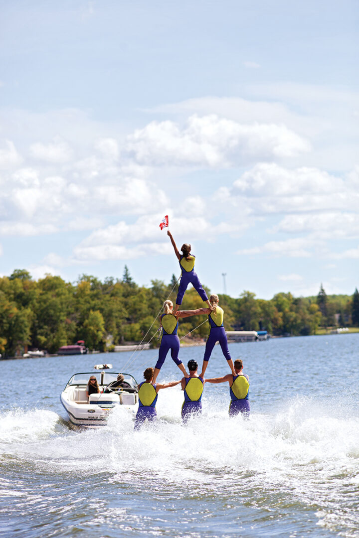 Club de Skinautique members nailing a pyramid formation on Lake Metigoshe.