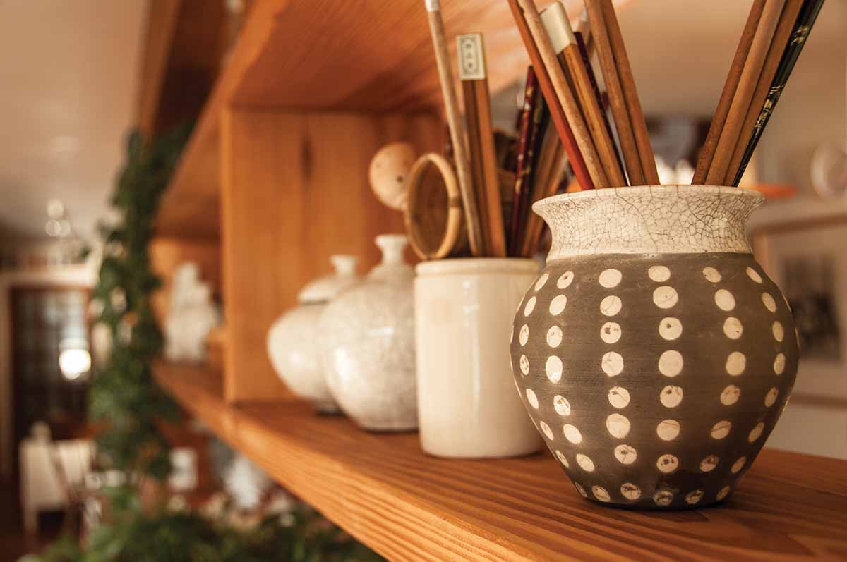 polka-dot pot holding assorted chopsticks
