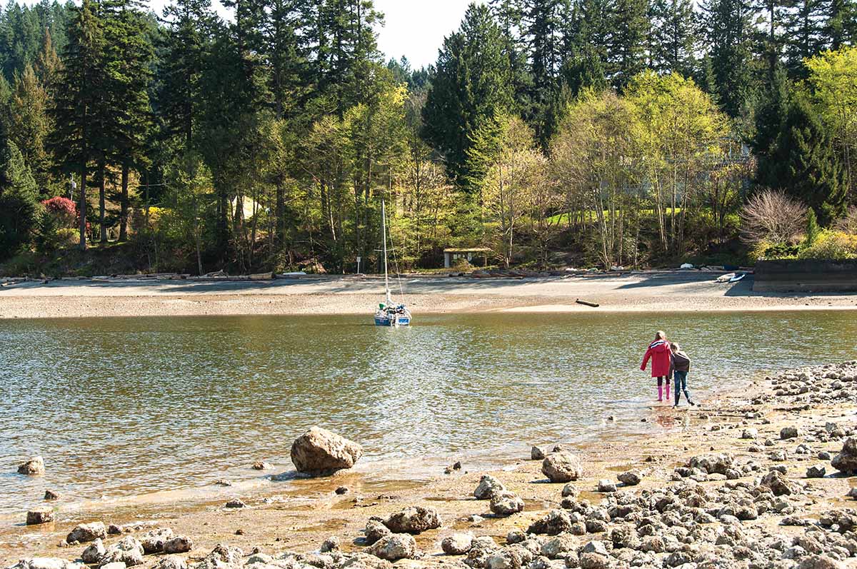Grandchildren Maia and Kieran exploring Deep Bay beach