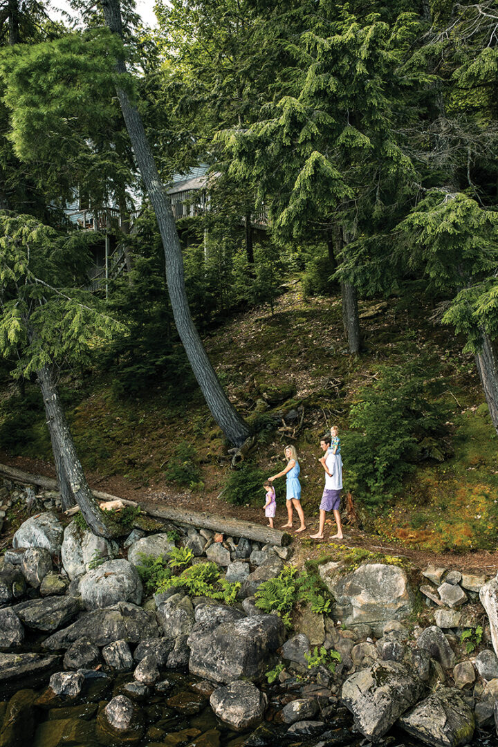 Cam, Rebecca, and the kids walk along their property