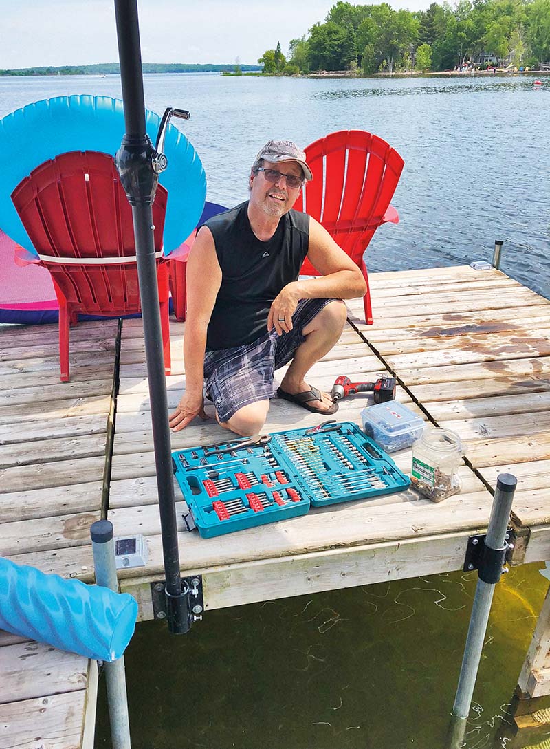 Joe V. on the dock with his tool box