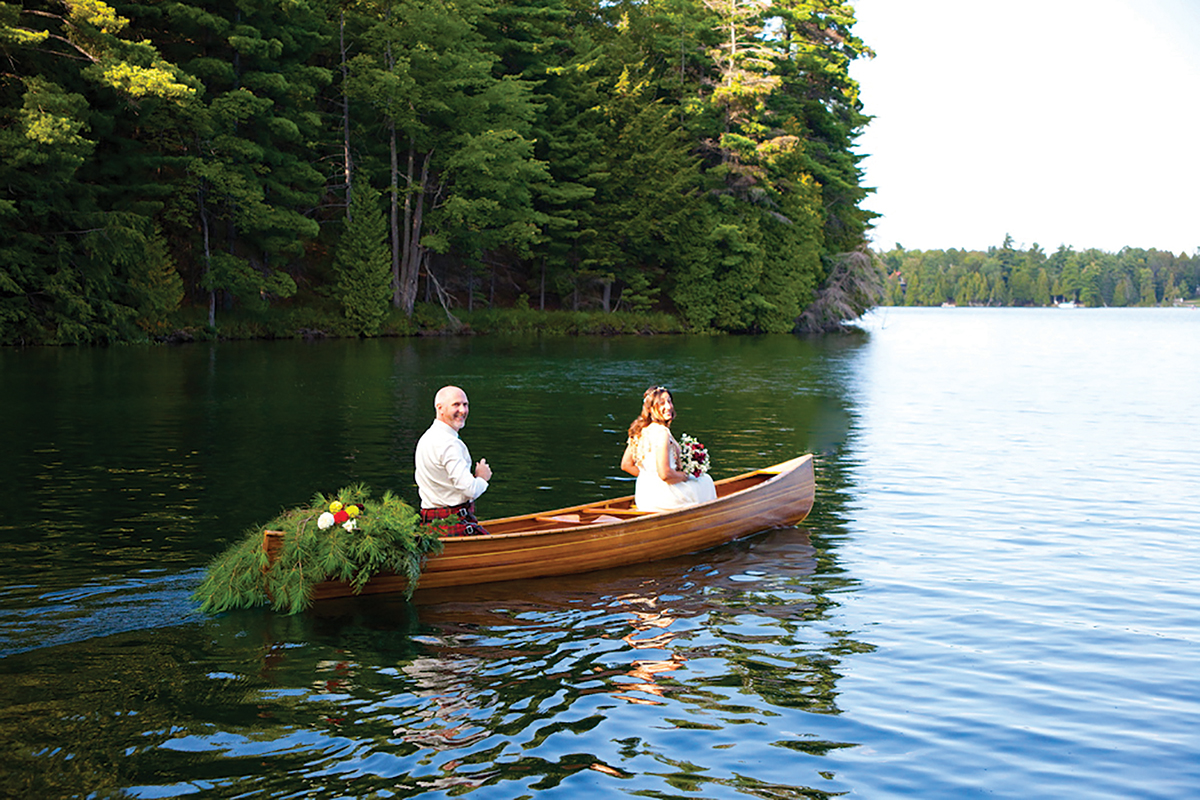 Nisha and Grant in their canoe on their wedding day
