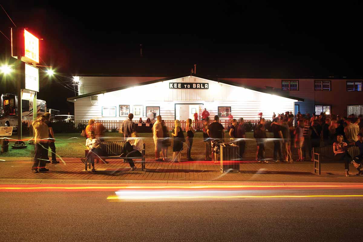 Concert-goers wait outside for the show