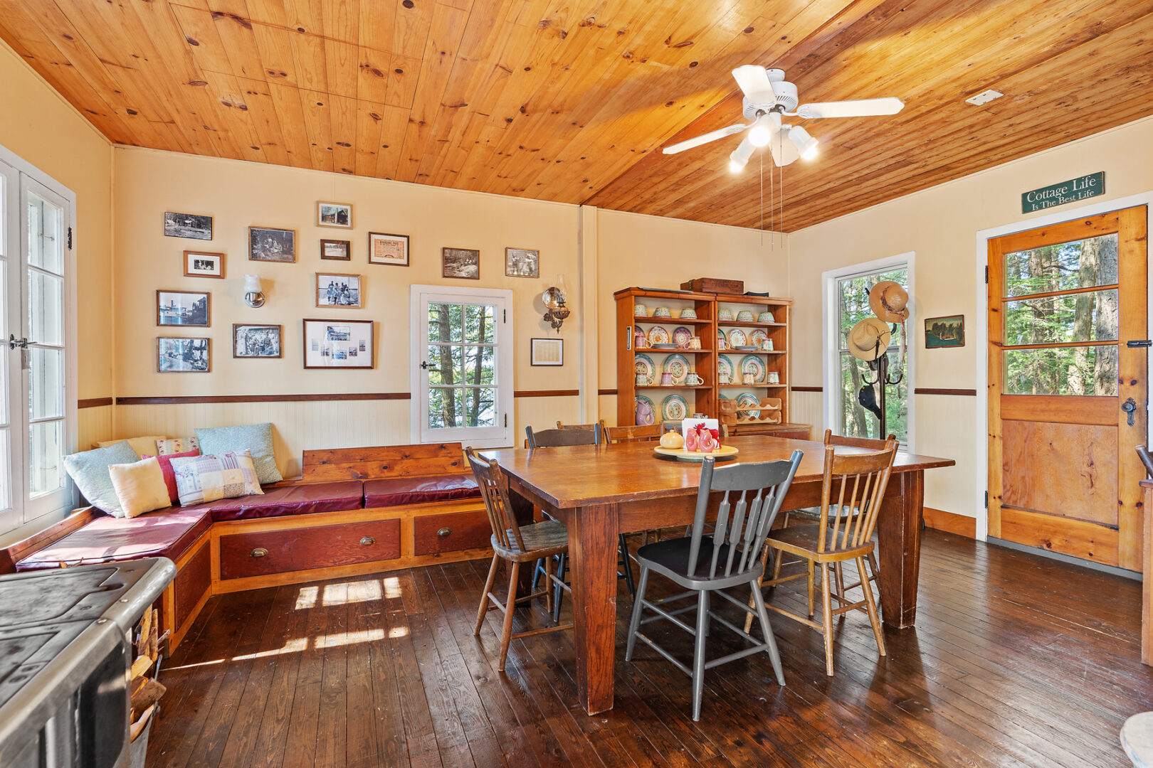 A small cottage dining area with a breakfast nook bench and a table and chairs.