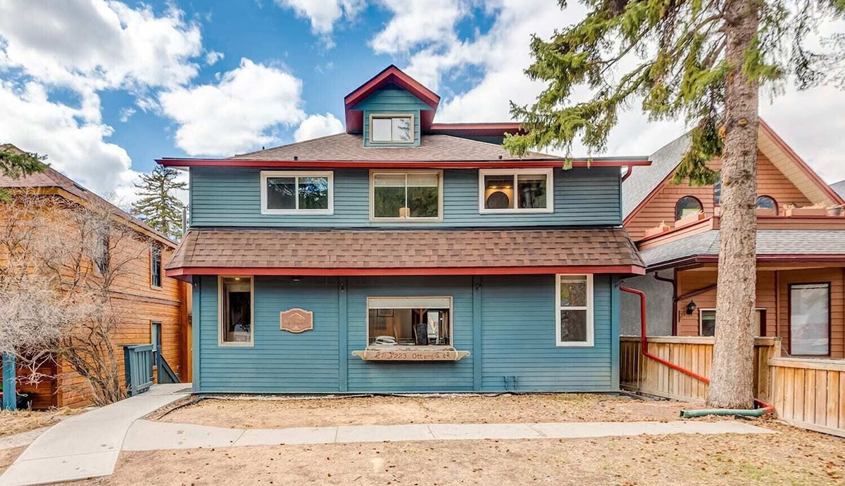 exterior of blue ranch-like cottage