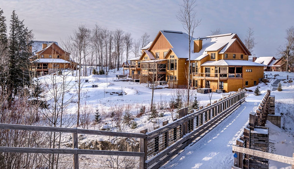 exterior of cottage covered in snow