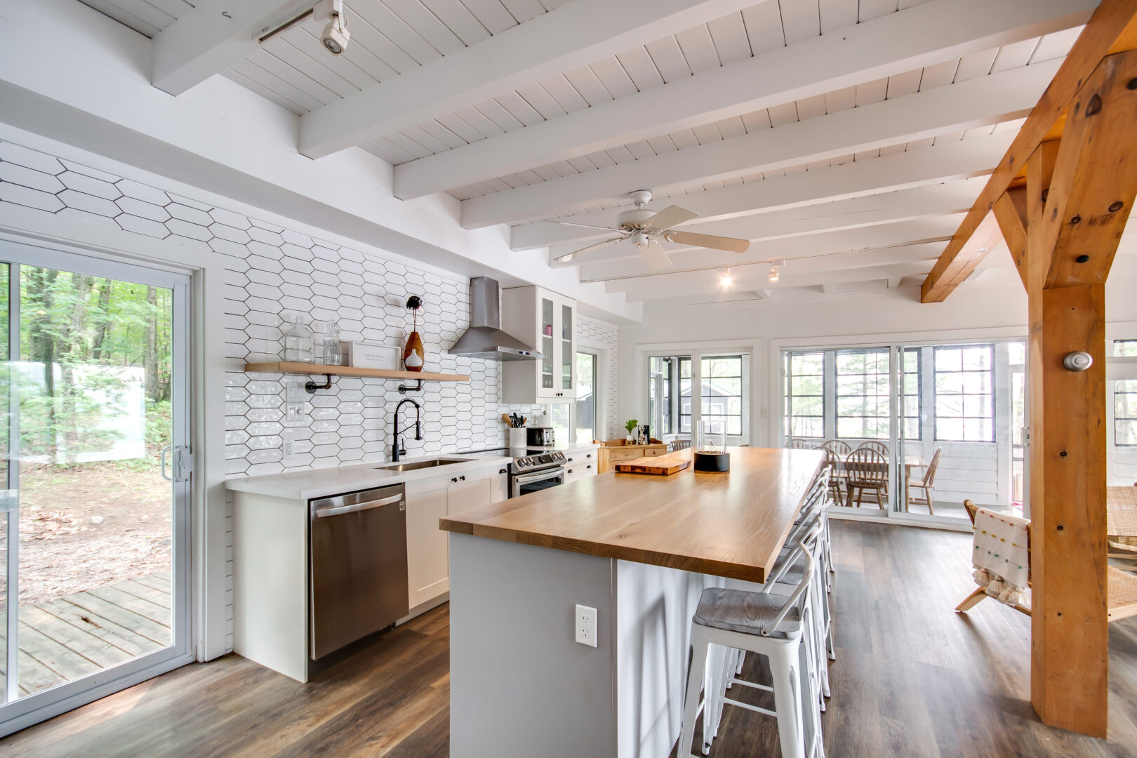 A large kitchen island with white stool seating.