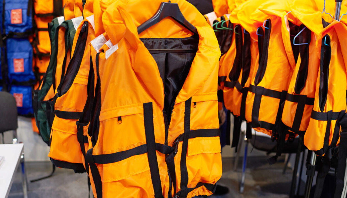 Rows of orange personal floatation devices