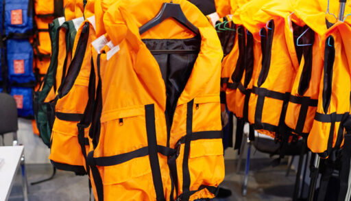 Rows of orange personal floatation devices