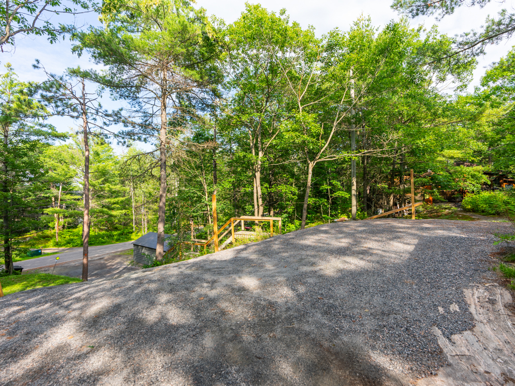 An elevated driveway leading into a cottage property.