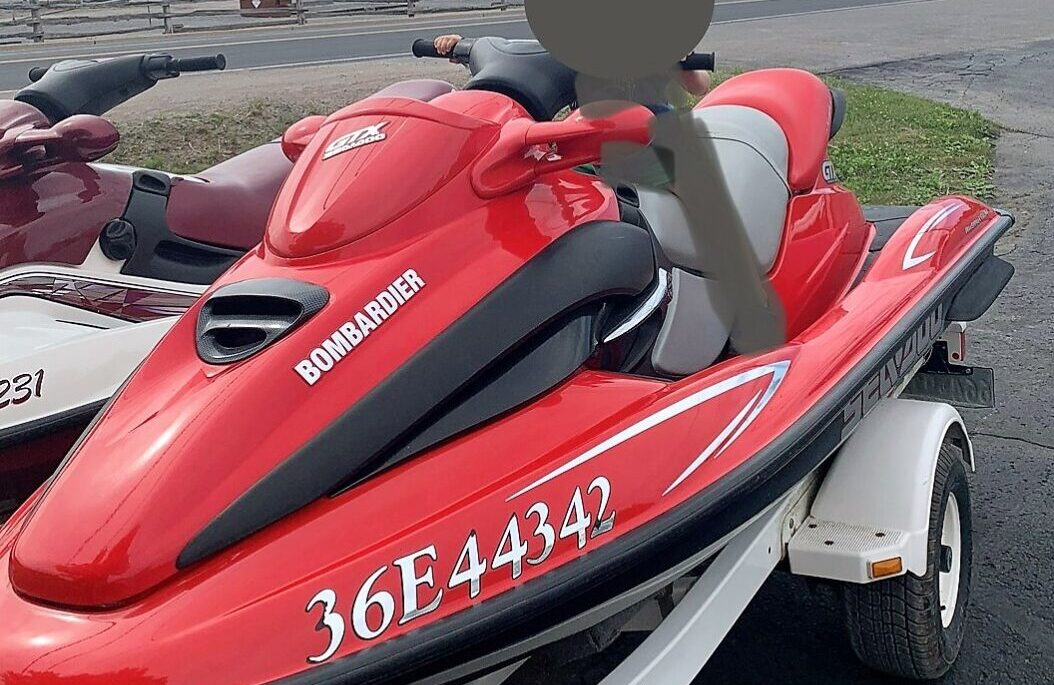 Red 2000 stolen PWC with ‘Bombardier 36E4432’ written on the side and ‘GTX Sea Doo’ in front of the steering handle.